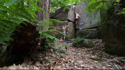 Bouldering in the forest on vertical rock