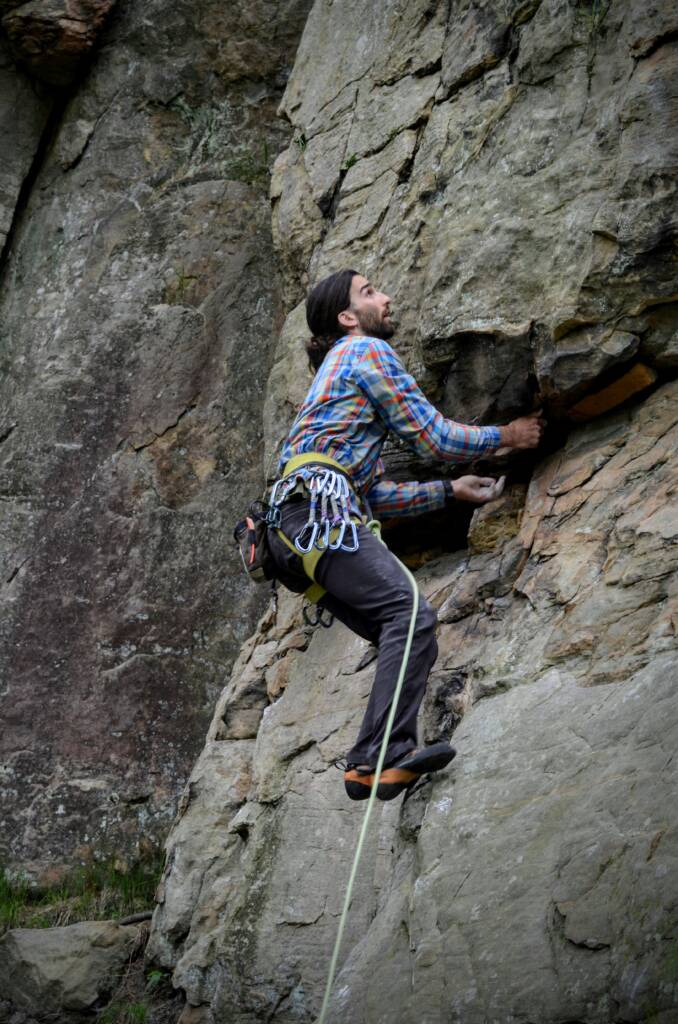 Coach Kubi sport climbing on sandstone at governers Dodge State Park in Wisconsin