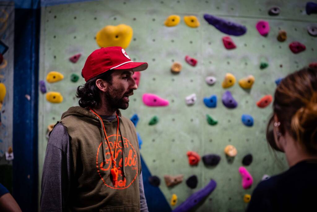 Coach Kubi giving instructions to the university of Wisconsin climbing team