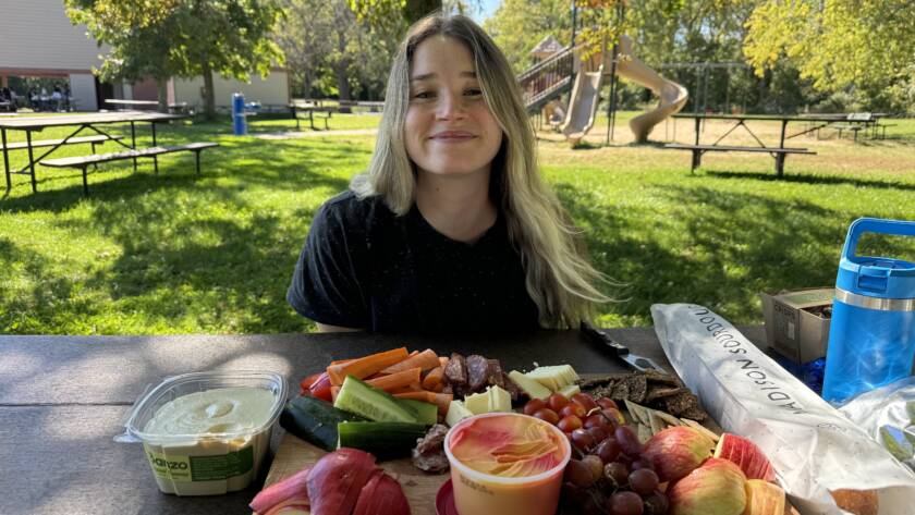 eating a tray full of nutritious food while training on your period