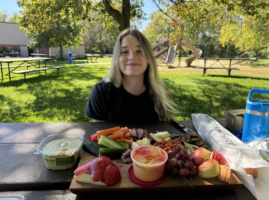 eating a tray full of nutritious food while training on your period