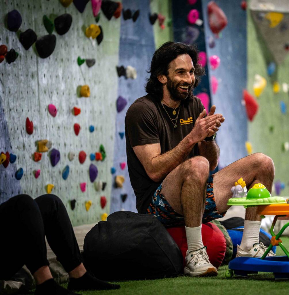 Movement is medicine that makes you smile like Coach Kubi sitting on this sandbag