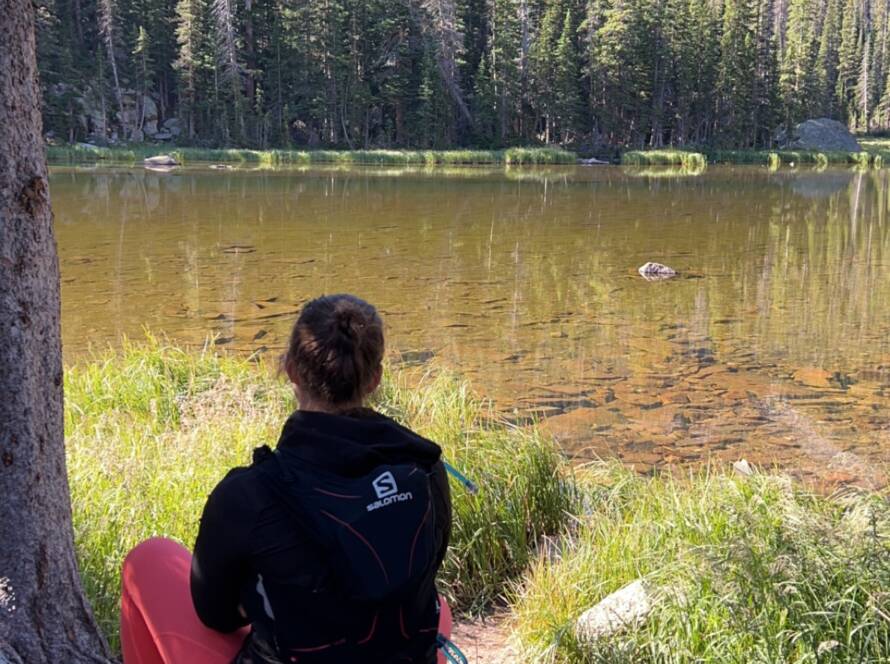 Courtney taking some time to enjoy the view during a long hike