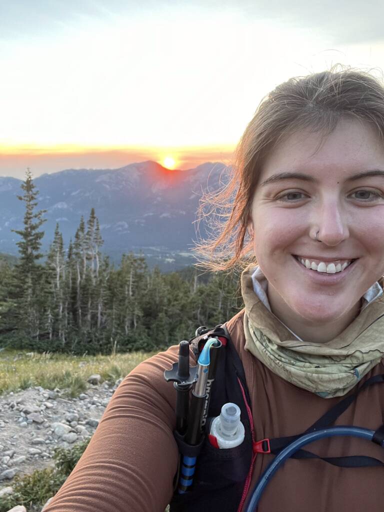 Courtney enjoying the sunrise during a long hike practicing non-exercise health habits