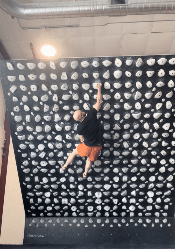 climbing is a fitness tool as Eamon demonstrates while climbing the kilter board