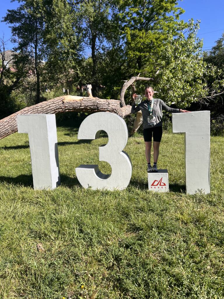 Tess standing after a half marathon