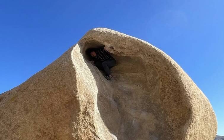 Eamon on a boulder in Joshua Tree National Park