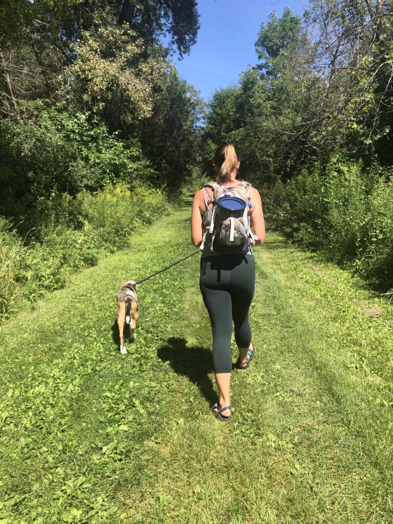 training heart rate zones - Courtney on a hike spending time in zone 2
