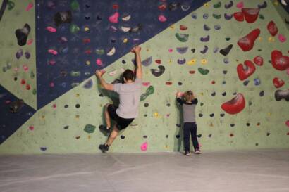 A father and Son participate in bouldering together at summit strength and fitness