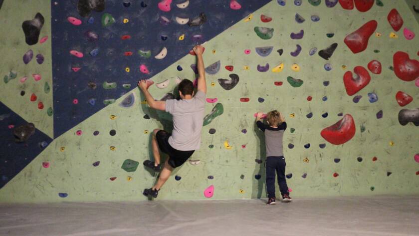 A father and Son participate in bouldering together at summit strength and fitness