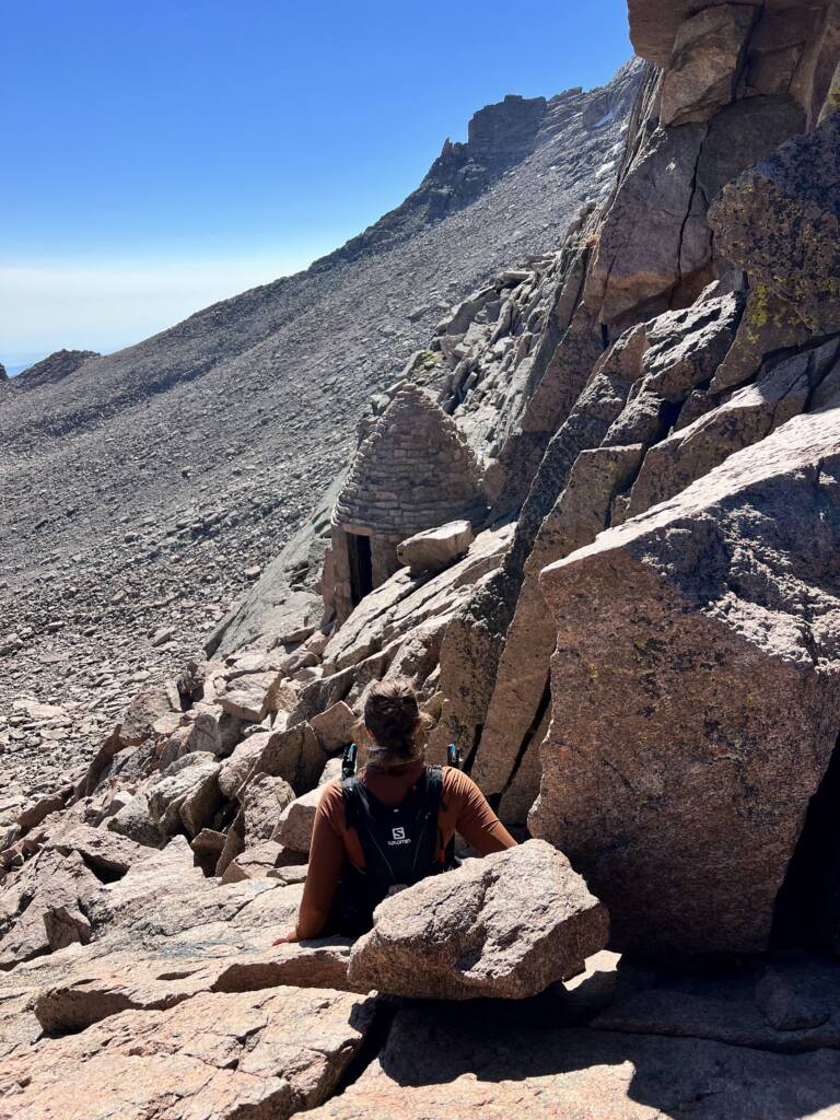Courtney scrambling down the keyhole route on Longs Peak in Rocky Mountain National Park