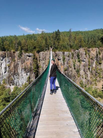 Courtney celebrating earth day on a suspense bridge in Canada
