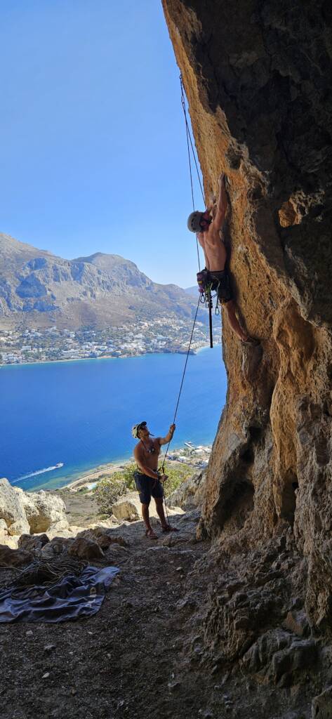 embracing the feeling of fear by rock climbing by the lake