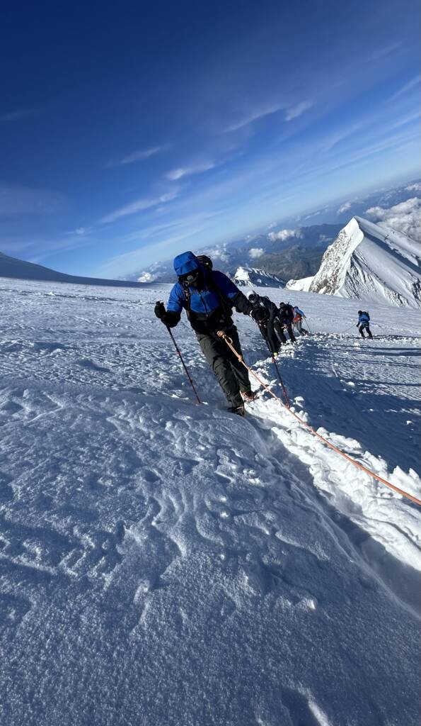 Climbing to a snowy summit, powering through imperfection in endurance sports