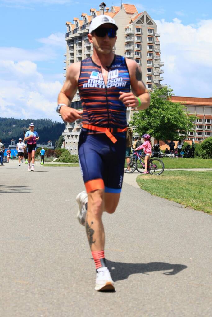 Keith running a race on a sunny day, showing up and embracing imperfection in endurance sports