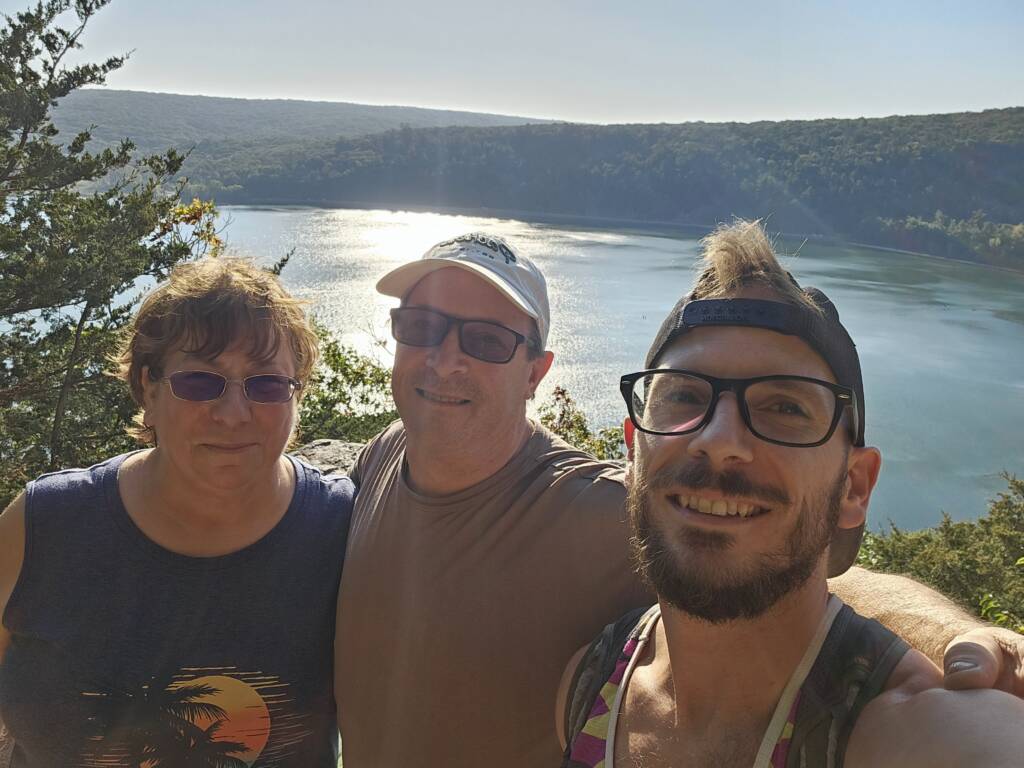 Coach Patrick and his family hiking around the lake