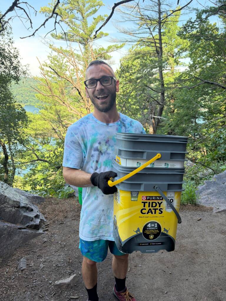 coach jolly volunteering at devils lake state park doing trail work
