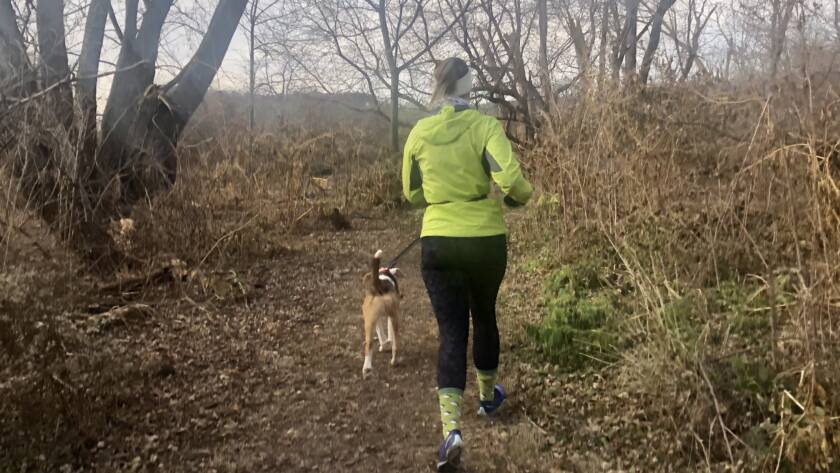 courtney running with her dog on ice age trails in madison