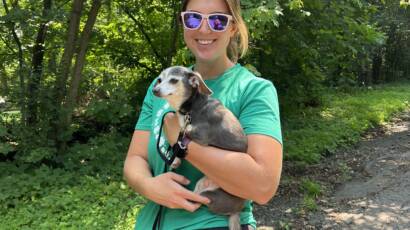 Courtney holding her small dog, post discussing capability vs capacity
