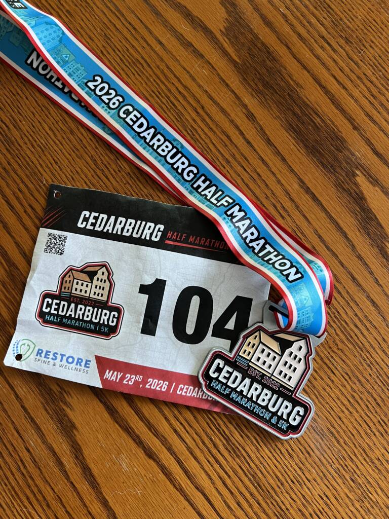 half marathon bib and metal, post discussing capability vs capacity.