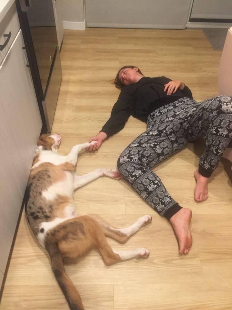resting on the kitchen floor practicing recovery techniques