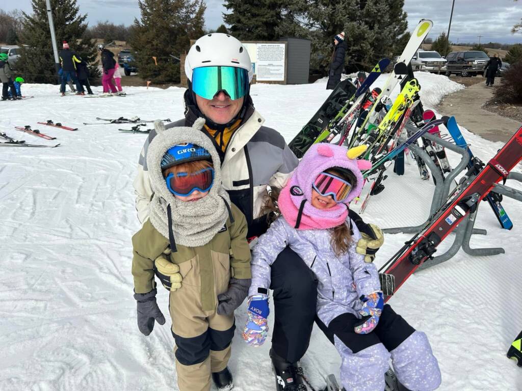family skiing together, practicing training for a lifetime of movement