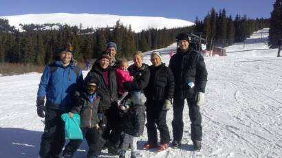 Family Skiing on a mountain after training for a lifetime of movement