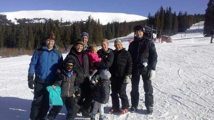 Family Skiing on a mountain after training for a lifetime of movement
